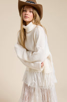 Fringe Hem Ribbed Turtleneck Sweater